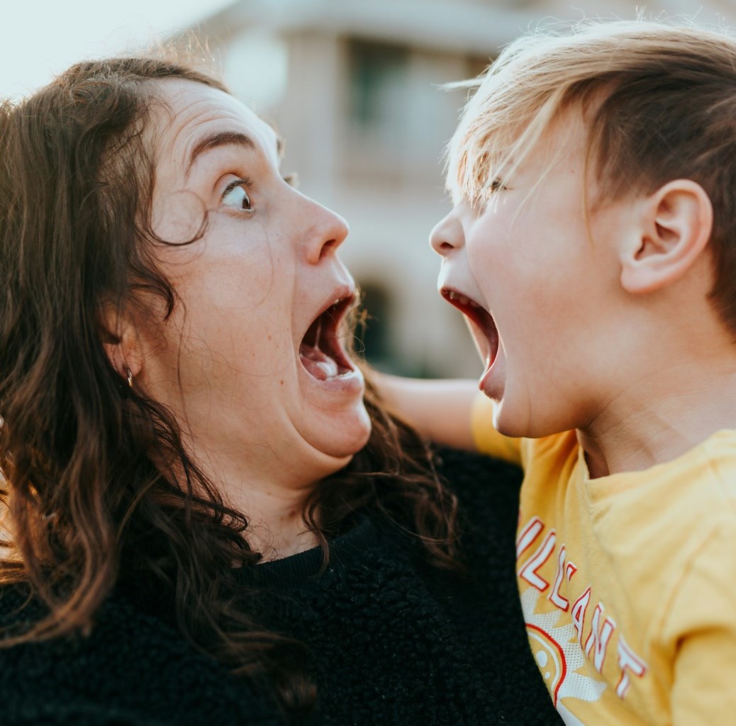A calm parent holding a child during a sensory meltdown — showing co-regulation in action