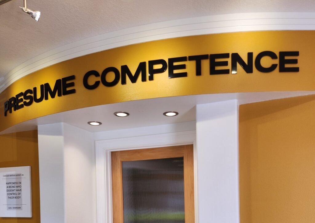 Motivational quote encouraging parents to presume competence in nonspeaking children with autism.